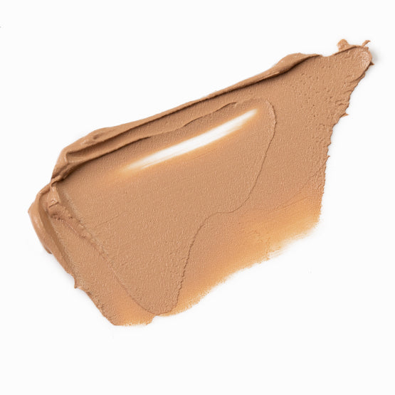 Image of a swatch of our cream Flawless Mineral Powdered Foundation #5-Warm Nude.  A medium warm tan color.