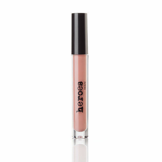 Image of a clear tube with a black lid. Contains a soft coral pink vegan matte lipstick.