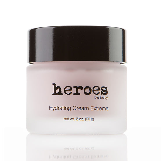 Image of a 2 ounce glass jar with black lid. It contains a light pink super hydrating cream for day and night. It is called Hydrating Cream Extreme.