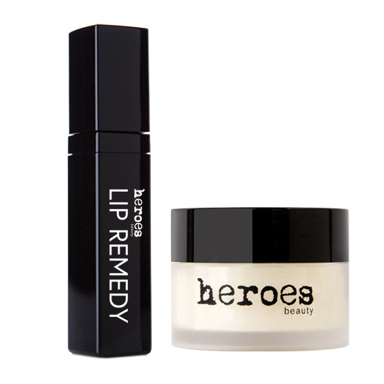 Image of a gift bundle of two best selling lip products. One Lip Remedy lip repairing gloss in a black square tube. One small frosted jar with black lid containing our sugar lip scrub.