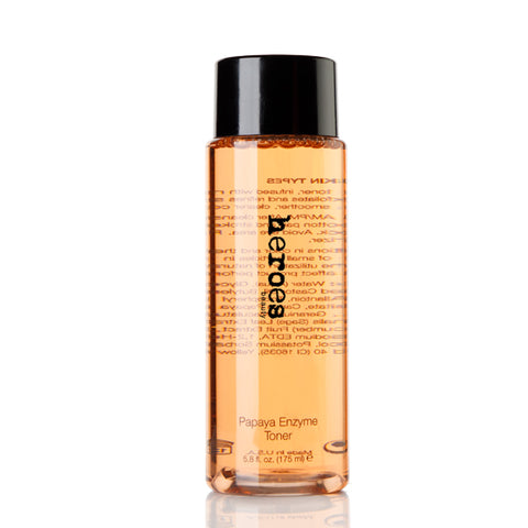 Image of a clear container with black lid containing our orange colored Papaya Enzyme Toner.  5.8 ounces.
