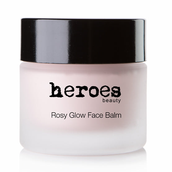 Image of a frosted 1.96 ounce jar with a black lid. It contains our Rosy Glow Face Balm. It is a lovely pink color.