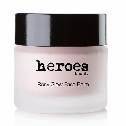 Image of a frosted 1.96 ounce jar with a black lid.  It contains our Rosy Glow Face Balm.  It is a lovely pink color.