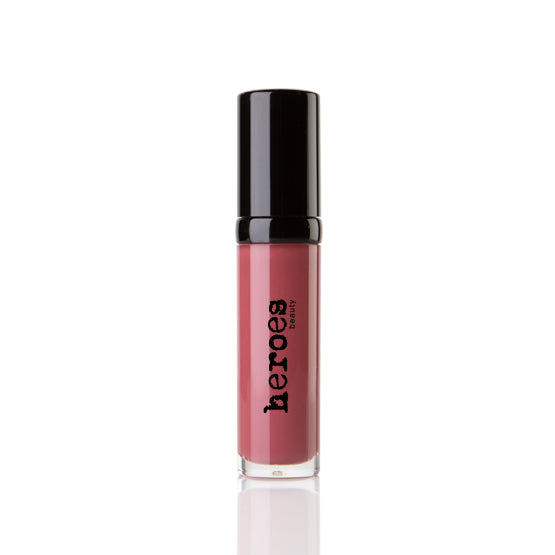 Image of a short clear tube with black lid. It contains our Luxe Lip Gloss in Naked in NY a rosy berry colored lip gloss.
