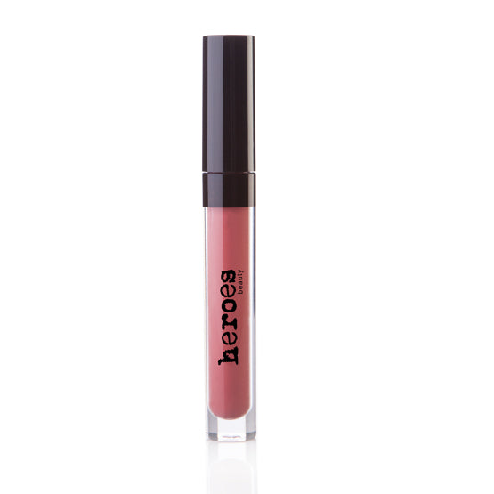 Image of a clear tube with a black cap containing a bright nude coral vegan matte lippie. 