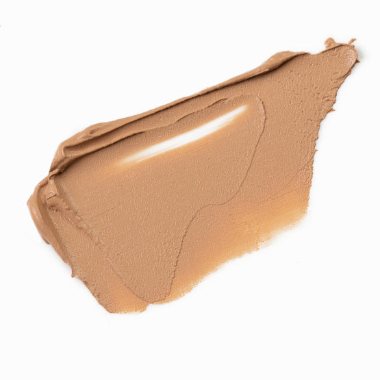 Image of a swatch of our cream Flawless Mineral Powdered Foundation #5-Warm Nude.  A medium warm tan color.  
