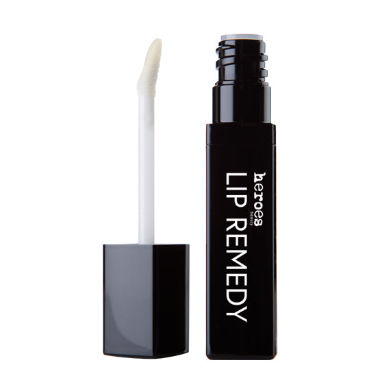 Image of a black tube of our Lip Remedy showing the doe foot applicator.  A clear lip gloss that helps chapped lips. 